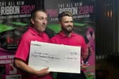 Oliver Lines stands with Landywood owner Paul Lloyd