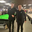 Champion Ben Mertens shakes hands with tournament official Gery De Mol.