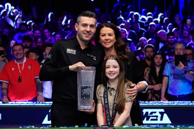 Mark Selby celebrates the 24th ranking event title of his career with his wife and daughter.