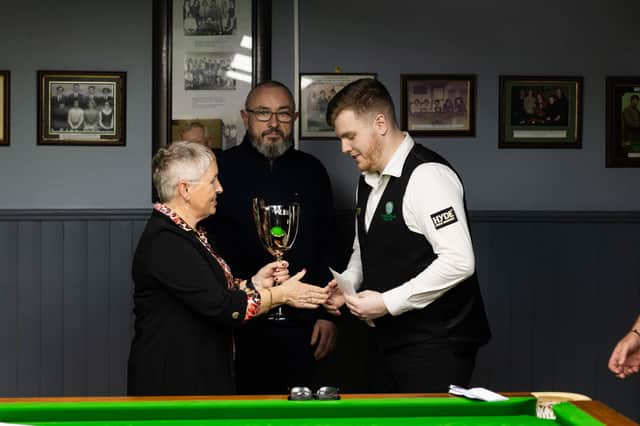 Champion Aaron Hill is presented with The Leo Kennedy Cup by Ann Kennedy. Photo: Mark Donovan Photography