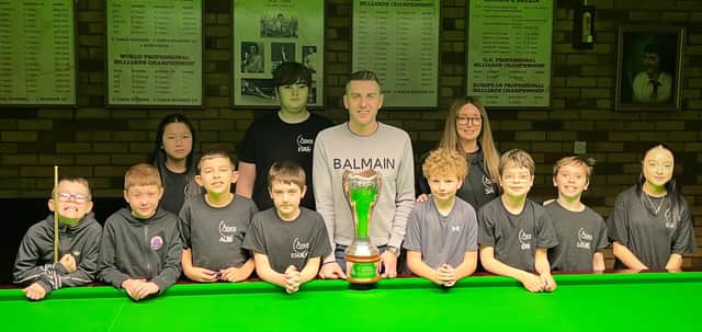 Mark Selby visited the Atack Snooker Club Junior Academy with the UK Championship trophy.